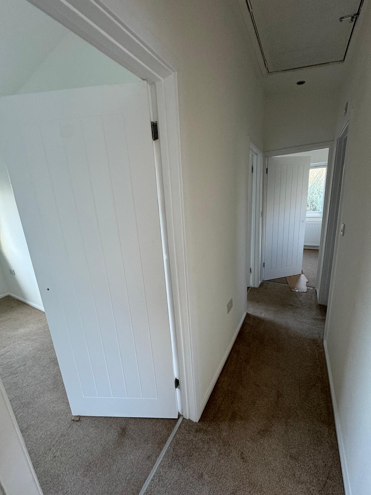 Clean white interior hallway with professional finish