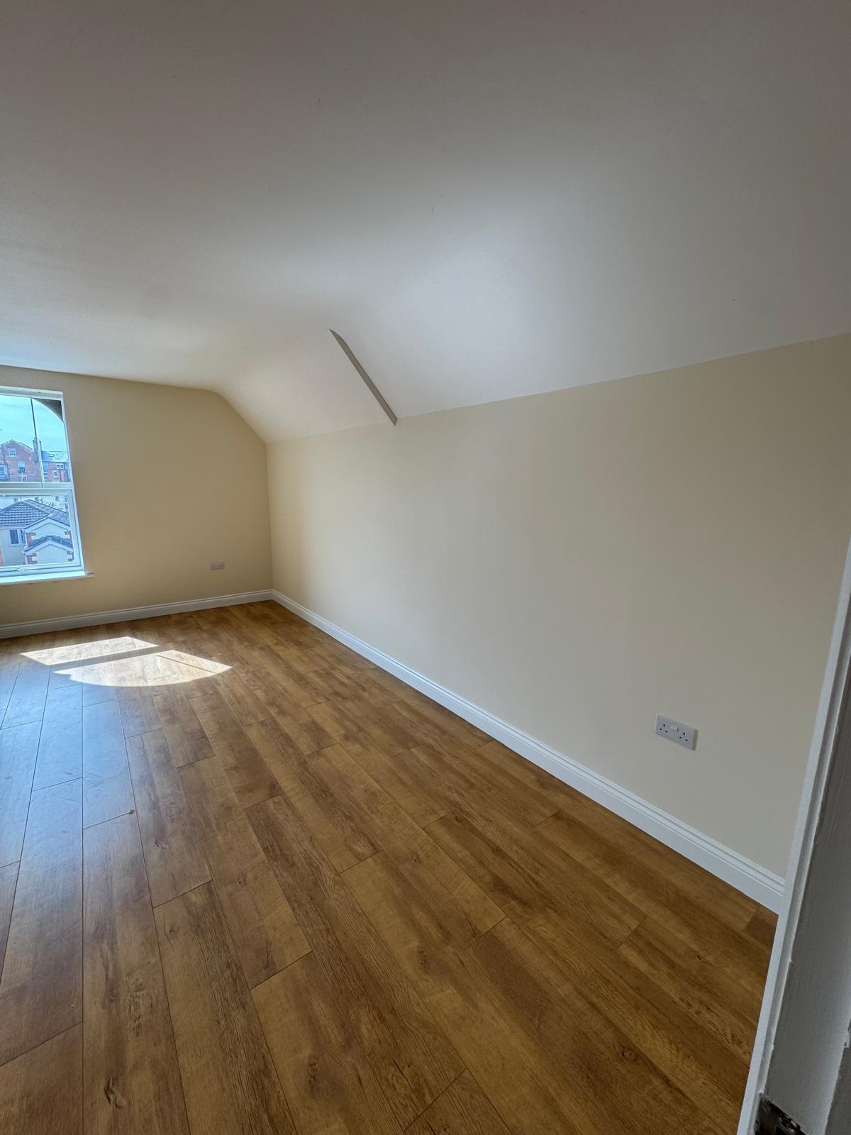 Empty room with cream walls and flooring